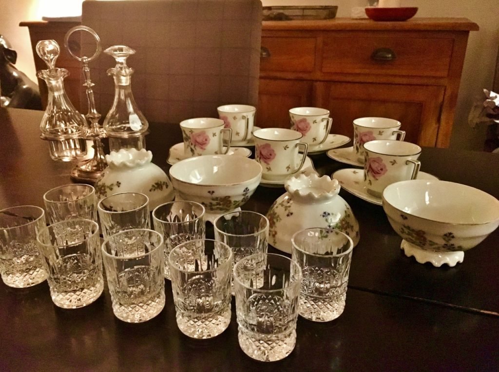 small table of antiques and vintage items purchased from a Paris flea market.