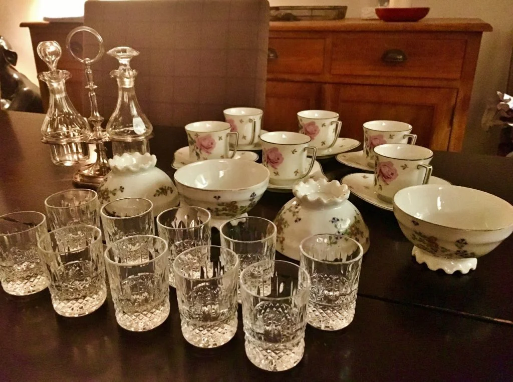 small table of antiques and vintage items purchased from a Paris flea market.