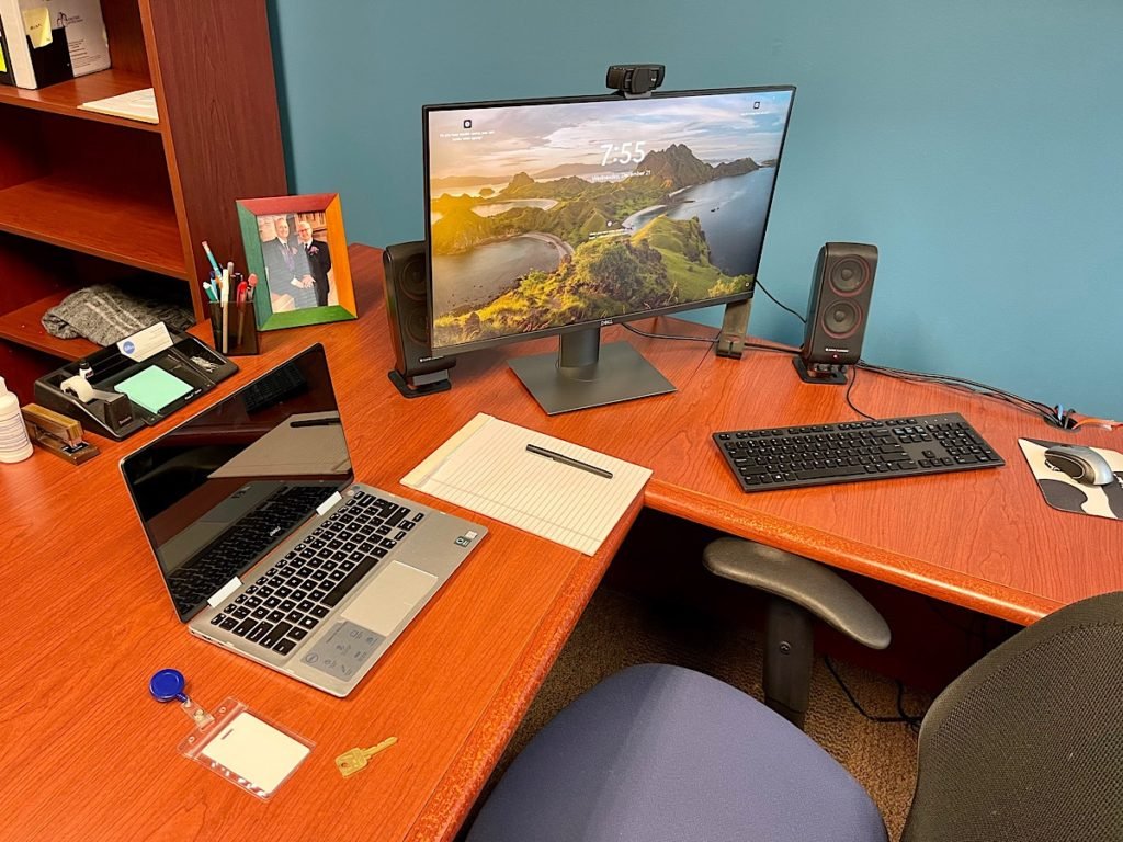 Office desk with electronics to return on last day of work before I retired today