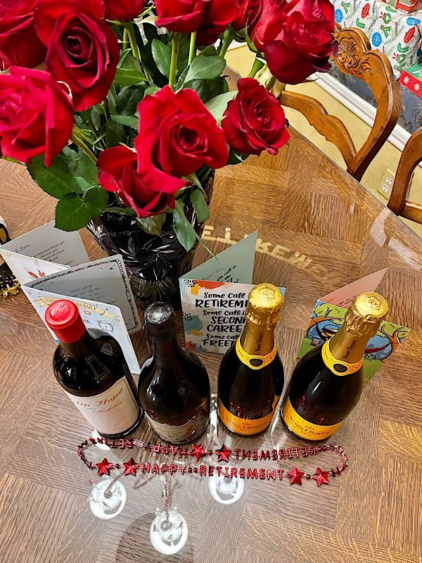 table with roses and champagne for retirement party